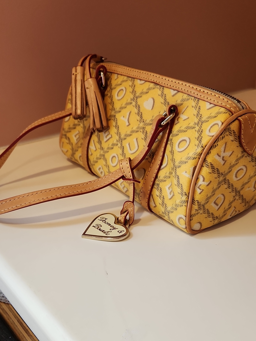 Dooney & Bourke Yellow Patterned Mini Barrel Bag with Tan Trim